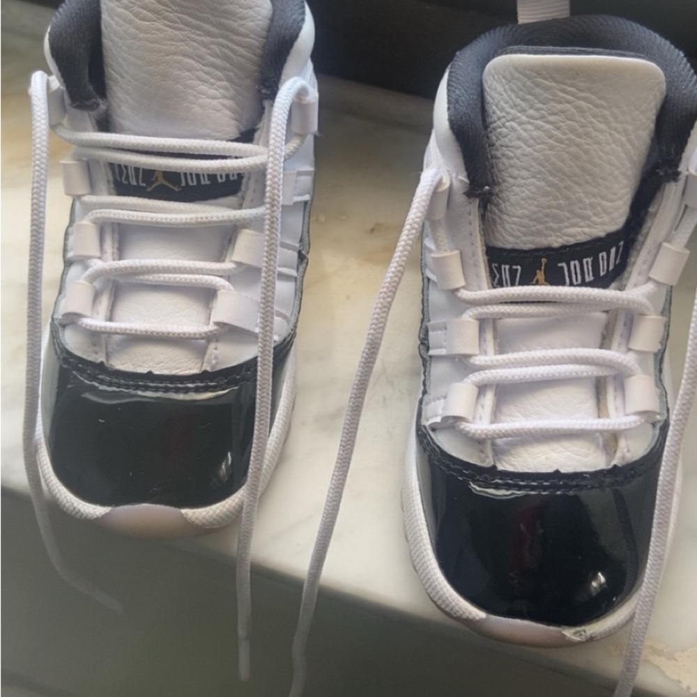 Jordan 11s Black and White Sneakers